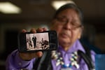 While eating lunch at one of his favorite local cafes, Ed Edmo shares a photo taken of him as a young man (center) singing in the drum circle while occupying the Portland Area Bureau of Indian Affairs office on Nov. 11, 1973. Also pictured, Al Smith (right) and Bear Cub (back right).