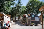 The tiny homes at Hazelnut Grove are built next to each other along one long walkway.