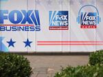 The logos for Fox programs are displayed on the News Corp. building on January 25, 2023 in New York City.