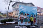 A child stands on their toes to look out of a cut out on Tuesday, Nov. 26, 2024, in Leavenworth, Wash.