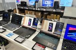 FILE - Laptop computers are displayed at a retail store in Vernon Hills, Ill., Thursday, Aug. 7, 2025.