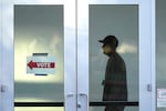 A poll worker monitors voting at a polling place at the Arizona State University campus, Tuesday, Nov. 5, 2024, in Phoenix, Ariz. 