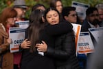 Atziri Cruz , Victor Cruz's daughter, embraces family friend Erin Palmer at the Washington County Courthouse in Hillsboro, Ore., on Wednesday, Oct. 29, 2025. Family, friends and some local officials held a press conference demanding the release of Cruz, who they say was unlawfully detained by Immigration and Customs Enforcement earlier that month.
