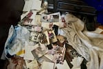 Scattered photographs and other items are seen on the floor of a home that was damaged during Israel's war with Hezbollah, in An-Naqoura, Lebanon.