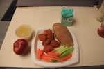 On Wings Wednesday at North Salem High School, students can order buffalo wings, cilantro ranch, celery, a roll, and fruits and veggies on the side. It's one of several options in the cafeteria.