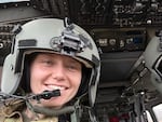 Capt. Rebecca Lobach smiles in the cockpit of a UH-60 Black Hawk helicopter, Feb. 28, 2024.