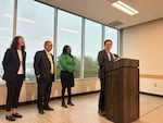 Washington Gov. Bob Ferguson announces proposed housing investments in a press conference in Seattle, alongside, from left to right, state Sen. Emily Alvarado, Lt. Gov. Denny Heck and Housing Development Consortium Executive Director Patience Malaba on Thursday, Dec. 18, 2025.