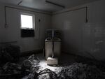 Demolished walls surround a bathtub at a recently shuttered nursing home in Armour, S.D., on May 29. The facility, which operated as the only nursing home in town for many years, closed after sustained staffing and financial pressures.