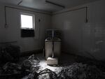 Demolished walls surround a bathtub at a recently shuttered nursing home in Armour, S.D., on May 29. The facility, which operated as the only nursing home in town for many years, closed after sustained staffing and financial pressures. 