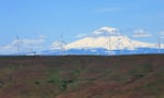 Wind turbines, with Mount Adams in the backdrop. A new report from Stanford researchers says it won't pencil out to store surplus wind power in grid-scale batteries.