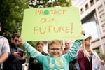 Nathan Porter holds his handmade sign at the Portland climate strike.