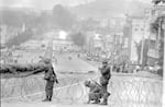 Government soldiers erect a roadblock on a street leading to downtown Gwangju, South Korea, with citizens looking on, on May 26, 1980.