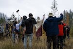 Katherine Ki'ya Wilson (center with shawl) leads a group of people in a planting ceremony held in Blue River on Nov. 10, 2024. The event was to promote healing and growth in an area recovering from the immense Holiday Farm Fire of 2020.