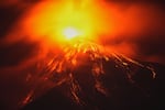 Lava flows out of the crater of the Fuego Volcano, as seen from San Juan Alotenango, Guatemala, Tuesday, Aug. 4, 2026.