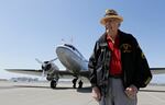 In this photo taken April 29, 2019, D-Day veteran Jake Larson poses before going for a ride in the "The Spirit of Benovia" World War II-era aircraft in Oakland, Calif.
