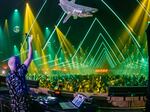Fatboy Slim performs onstage at the Coachella Valley Music and Arts Festival in Indio, Calif., on April 24. Festivals and other gatherings are coming back despite the lingering COVID-19 pandemic.