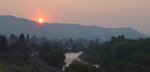 Hazy skies caused by wildfire smoke are creating increasingly common scenes like this in Eastern Washington' above the Wenatchee River in August, 2018.