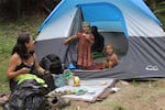 A Seattle family prepares for the annual kid's parade at 2017 gathering of the Rainbow Family of Living Light. 