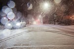 A car drives north on Tacoma Street in Portland's Sellwood neighborhood during a snow storm on Tuesday, Jan. 10, 2017.