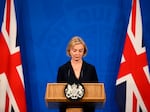 Britain's Prime Minister Liz Truss attends a news conference in the Downing Street Briefing Room in central London, Oct. 14. Truss has only been in office for six weeks but has already drawn calls for her removal.