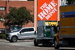 The Home Depot logo is displayed outside a store in Los Angeles where immigration agents arrested day laborers after jumping out of a rental moving truck.
