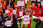 FILE - Deb Wilson, president of the Leisure Manor Tenants Association, a mobile home park in Aberdeen, Wash., attends a rally advocating for lawmakers to adjust and pass House Bill 1217, a rent-control bill, at the Washington State Capitol Building Friday, April 18, 2025, in Olympia, Wash.