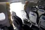 This photo released by the National Transportation Safety Board shows a gaping hole where the paneled-over door had been at the fuselage plug area of an Alaska Airlines flight Jan. 7, 2024, in Portland, Ore. A panel used to plug an area reserved for an exit door on the Boeing 737 Max 9 jetliner blew out Jan. 5, forcing the plane to return to Portland International Airport.