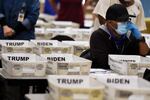 Cobb County Election official sort ballots during an audit, Friday, Nov. 13, 2020, in Marietta, Ga.