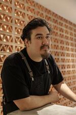 Pedro Tobar poses for a portrait at the newly opened alley bar, Providencia, in NE Washington, D.C., on Thursday, December 12, 2024.