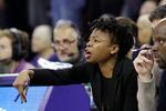 Then-Maine assistant coach Edniesha Curry motions during an NCAA college basketball game against Washington on Tuesday, Nov. 19, 2019, in Seattle. Now the former WNBA guard known as Eddie is an assistant coach on Trail Blazers coach Chauncey Billups' staff, the first woman to serve as an assistant in Blazers' history and currently one of just six women who are coaches in the NBA.