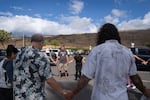 A group of volunteers with Maui Medic Healers Hui gather before heading out to help people affected by the fires in Lahaina.