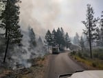 An undated, supplied image shared on July 13, 2024 shows fire engines working along Forest Service Road 43 as they battle the Falls Fire, burning north of Burns, Ore.