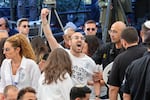 A man shouts as Israeli Prime Minister Benjamin Netanyahu speaks during a ceremony marking the Hebrew calendar anniversary of the Hamas attack on October 7 last year, at the Mount Herzl military cemetery in Jerusalem, Israel Sunday Oct. 27, 2024.