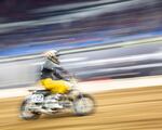 Portlander Andy DiBrino races around a turn during the One Pro Race at Veterans Memorial Coliseum in Portland, Ore. DiBrino is a decorated racer and has won the One Pro Race three times.