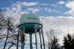 A water tower near a train track in Woodburn, Ore., Jan. 15, 2025. The town faces fear and anxiety following the second inauguration of President Trump.