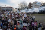 Thick clouds of tear gas, deployed by federal immigration officers, fill the air hundreds of protesters, including children and elderly people, demonstrate outside of the ICE building in Portland, Jan. 31, 2026.