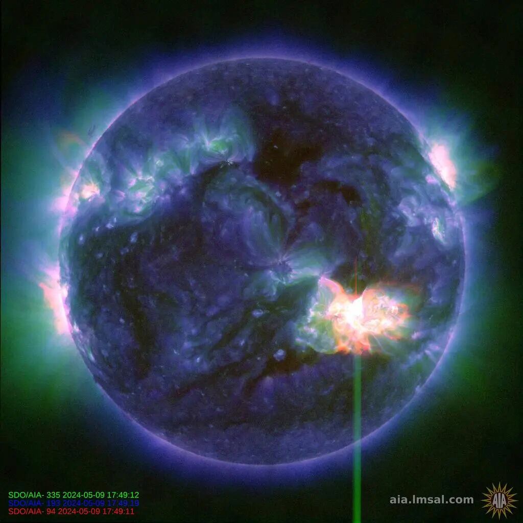 This image provided by NASA shows a solar flare, as seen in the bright flash in the lower right,  captured by NASA’s Solar Dynamics Observatory on May 9, 2024. A severe geomagnetic storm watch has been issued for Earth starting Friday and lasting all weekend  _ the first in nearly 20 years. (NASA/SDO via AP)