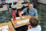 Douglas Education Service District mentor Beth Hunter works with elementary school students in the Elkton School District on Wednesday, Aug. 26, 2026. After success with mentors in middle and high school, Elkton is expanding its mentor offerings to its youngest students.