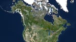 A satellite map of North America, highlighting the U.S.-Canada boundary line.