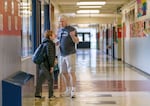 Paraeducator David Waldrip encourages a student to return to his classroom at Cedar Park Middle School, Feb. 22, 2023. 