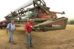 Chad Heimgartner (right) and his dad Lee Heimgartner farm about 4500 acres near Kendrick, Idaho. They're getting their combine ready to harvest chickpeas.