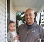 Jason Washington was killed by Portland State University police in 2018. Here, he holds his granddaughter, Kailee.
