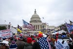 FILE - Rioters loyal to President Donald Trump rally at the U.S. Capitol in Washington, Jan. 6, 2021.