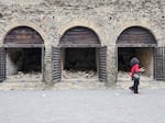 A view of the skeletons of the fugitive victims of the eruption of Vesuvius in 79 AD on the ancient beach, open to the public for the first time, in the archaeological excavations of Herculaneum.