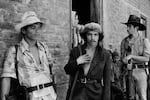 Guerrillas from the Ejército Revolucionario del Pueblo (People's Revolutionary Army, or ERP), speak with local residents of San Agustín, in El Salvador's Usulután department, July 5, 1983.