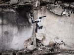 Graffiti of a woman in a leotard doing a handstand is seen on the wall of a destroyed building in Borodyanka on Friday in Kyiv Region, Ukraine. Banksy later confirmed on their Instagram account that this piece was their work.