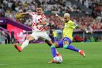 Neymar of Brazil takes a shot against Dejan Lovren of Croatia during the FIFA World Cup 2022 quarterfinal match between Croatia and Brazil at Education City Stadium on December 09, 2022 in Al Rayyan, Qatar.