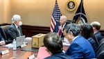 President Biden meets with his national security team on July 1 to discuss the drone strike that killed al-Qaida leader Ayman al-Zawahiri on July 31. CIA Director William Burns is on the left. The wooden box in front of the president contains a replica of the house where al-Zawahiri was living in Kabul, Afghanistan. The model is now on display at the CIA museum.