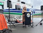 Former Commissioner of Public Lands Hilary Franz speaks to reporters at the Department of Natural Resources hanger at the Olympia Regional Airport in October 2023.