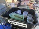 Reusable dishes and cups provided by strategy company Perennial Zero Waste at the Seattle Parks watch party during the FIFA World Cup match on Juneteenth.